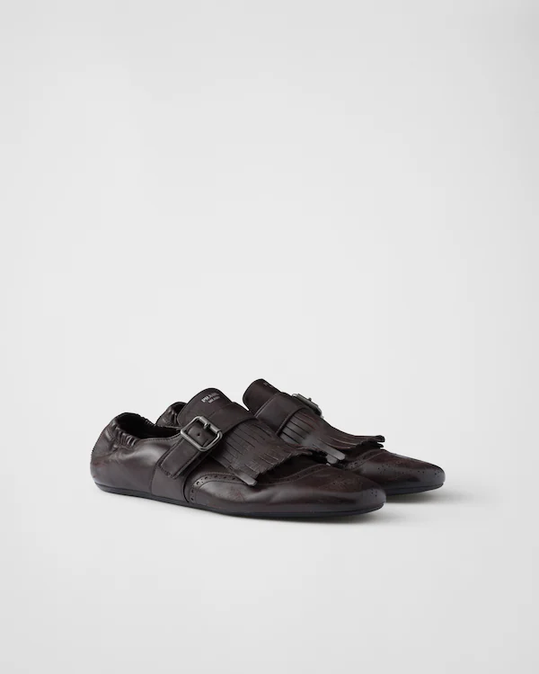 Chaussures à brides monastère frangées